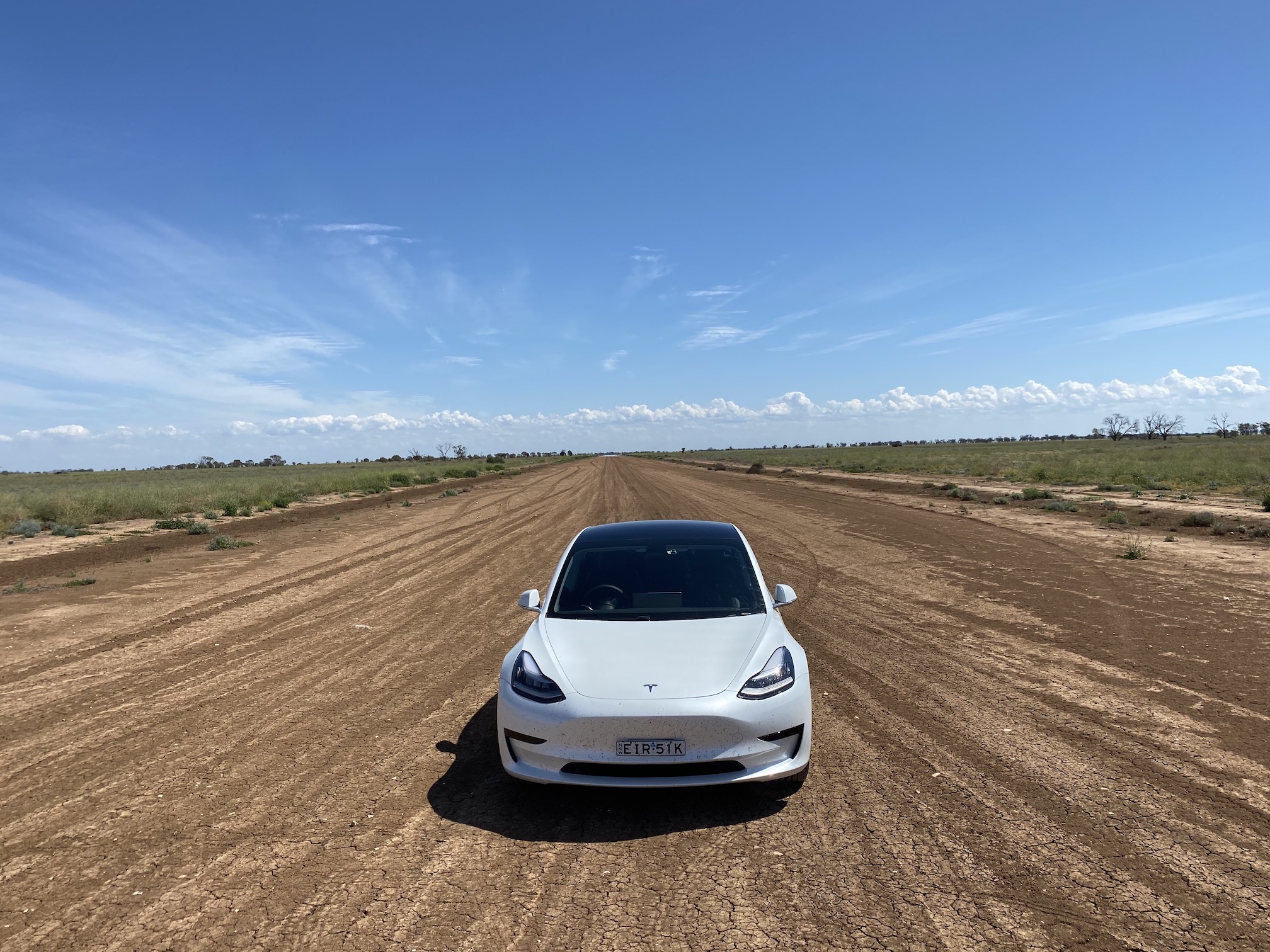 tesla on dirt road