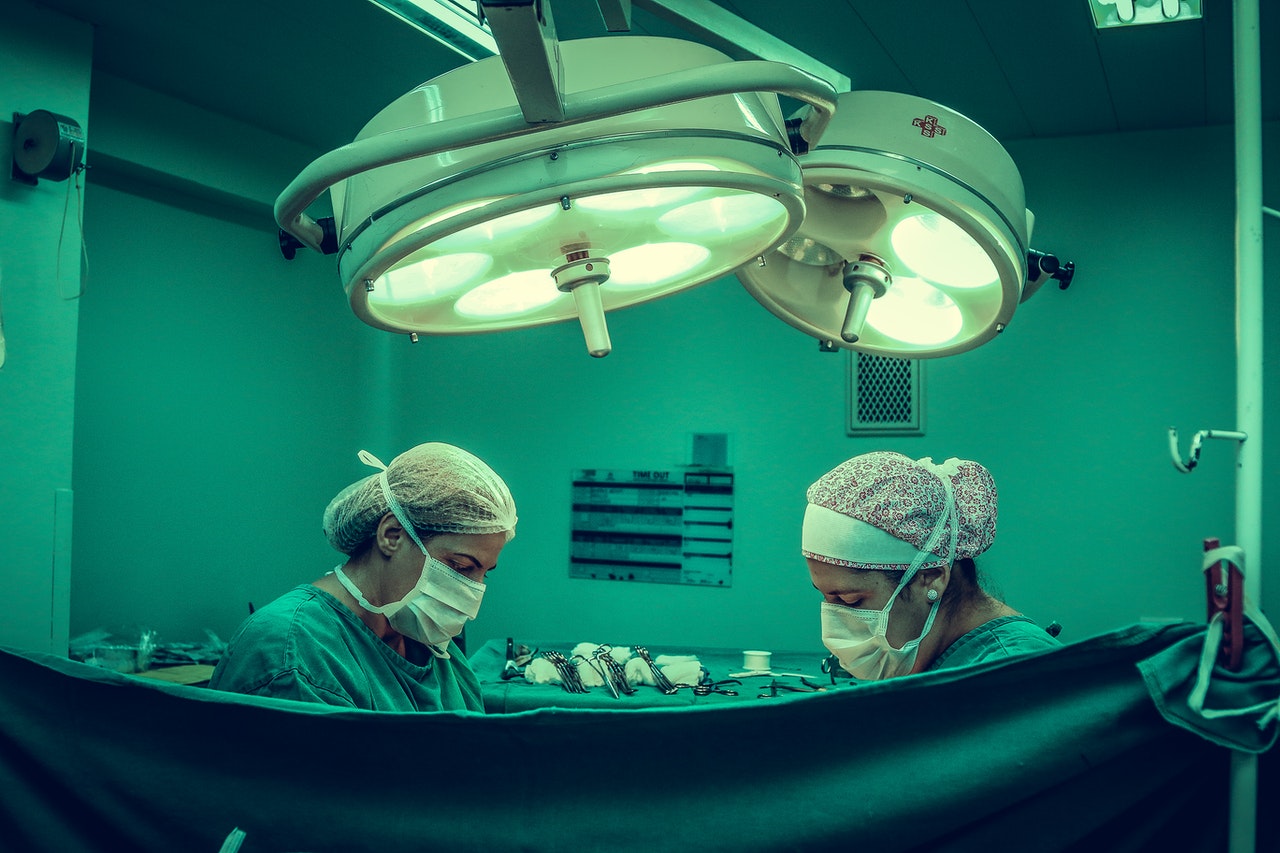 Operating table with two doctors under Bright lights